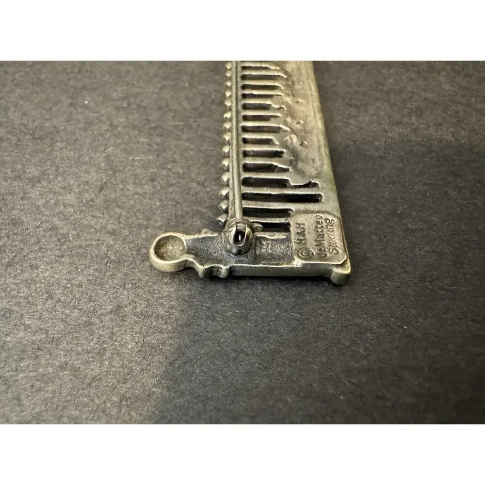 Hand & Hammer Silversmiths brand hand